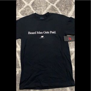 NEW BALANCE KAWHI LEONARD BOARD MAN GETS PAID TEE BLACK